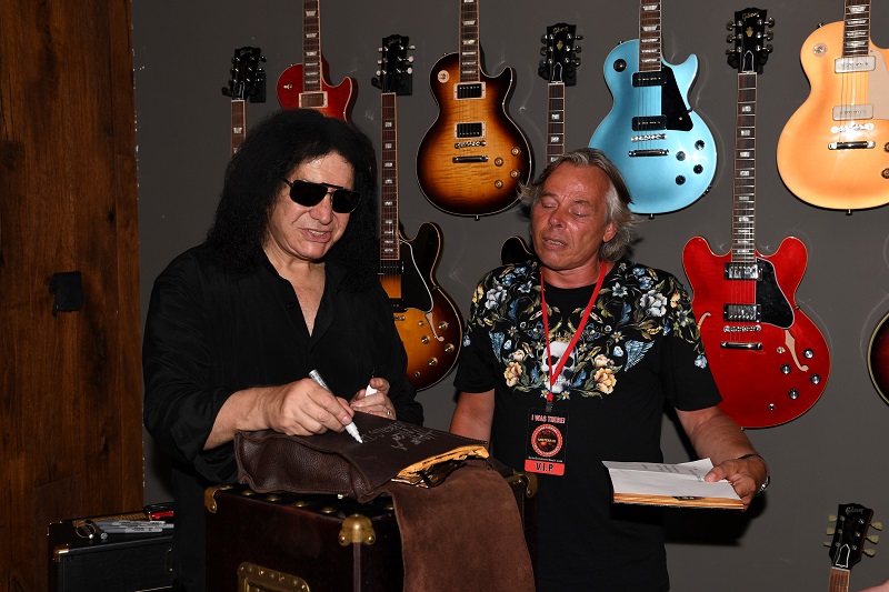 signing my Gene Simmons Moneybag Luge Roller